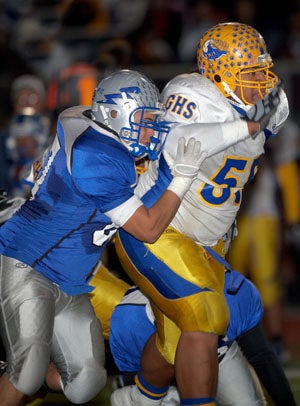 Moala (55) has little trouble getting by the first blocker.