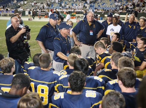 Aquinas head coach George Smith addresses his team after its huge victory over Byrnes.