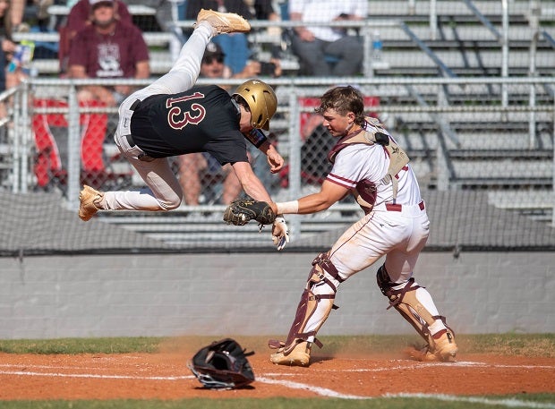 E.D. White catcher Jax Triche puts the tag on a Northlake Christian runner at the plate in the Cardinals' 12-3 victory. (Photo: Brad Weimer)