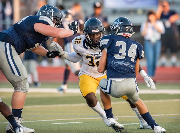 Highland Park senior Prince Dorbah (32) requires more than one blocker.
