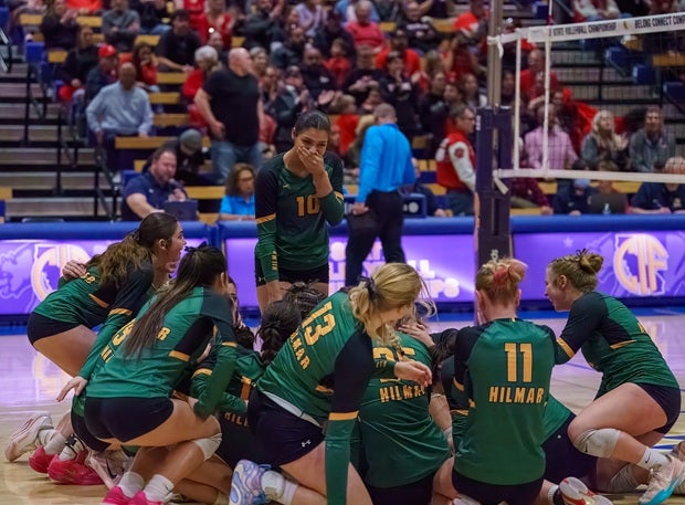 Hilmar's Rowan Takhar, who was injured in warmups Friday, celebrates with her teammates after winnnig the CIF Division V title over Elsinore. (PHOTO: Diane Torrence)