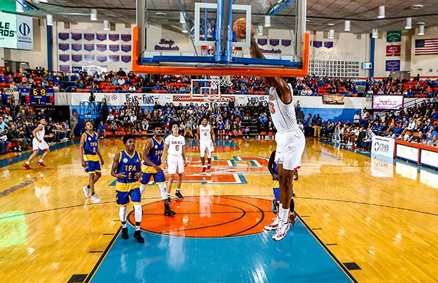 Oak Hill Academy center David McCormack dunks during the Marshall County Hoopfest.