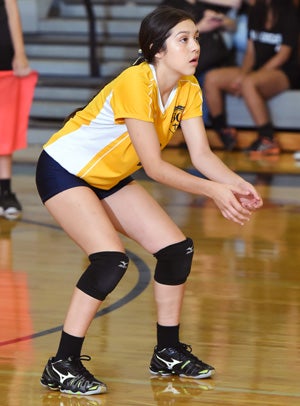 Gameros changed positions this year to help
her team, and has set school records because of it.