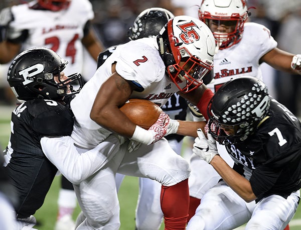 LaSalle's Jarell White had a team-high 10 tackles and 35 yards rushing on 12 carries in the Lancers 14-7 win over Perry.