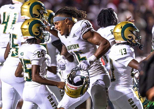 Tyler Atkinson and teammates celebrate an emotional overtime win over Alabama powerhouse Thompson last season. (PHOTO: Travis Kirkland)