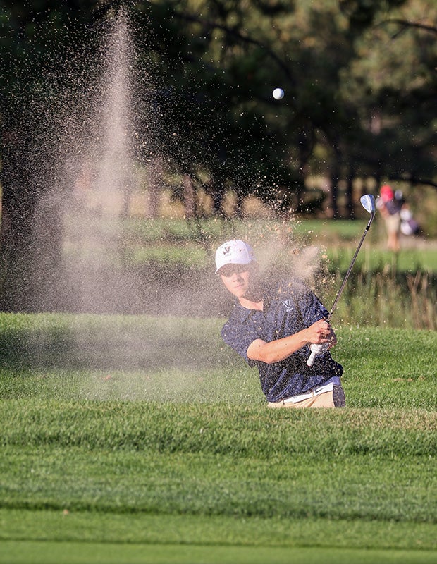 A golfer hits out of a sand trap during the Kadet Invitational in Colorado.