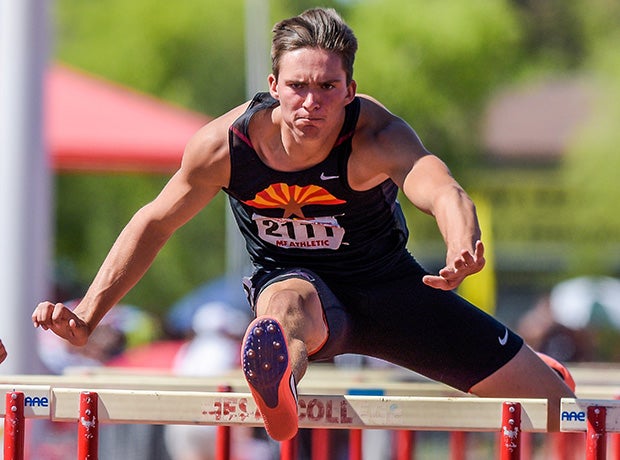 Cole Jaquette of Red Mountain (Ariz.) competes during the boys final in the 110 meter hurdles at the AIA State Track and Field Championships.
