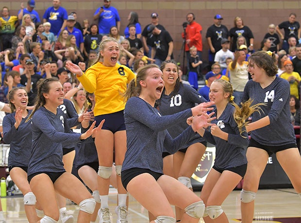 Boulder City (Nev.) players rush the court after winning the NIAA 3A state championship against Moapa Valley.
