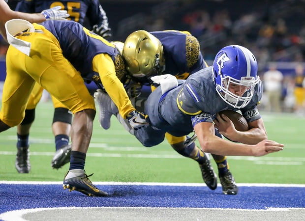 Bingham quarterback Matt Degn dives into the end zone while scoring on a 6-yard run.