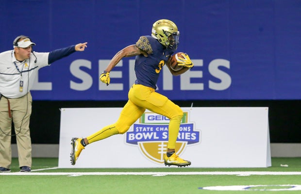 Aquinas receiver Mike Harley scores on a 40-yard scoring pass during the first half.