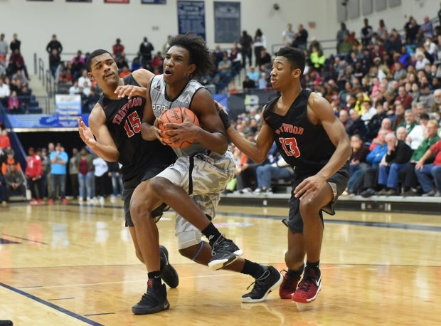 Abu Kigab powers between two defenders at Flyin' to the Hoop in Ohio earlier this month.