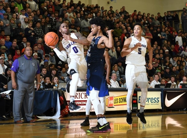 Miami signee Chris Lykes of No. 11 Gonzaga takes it to the basket against Marvin Bagley III in a December game at the Les Schwab Invitational in Oregon.