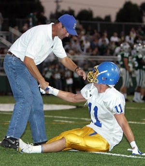 John Mannion shakes hands with Johnny Millard
before Foothill's game versus De La Salle in 2008.