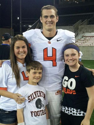 Sean at an Oregon State game with sisters Katie
and Megan and brother Brian