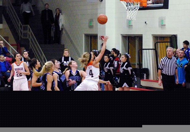 Claire Cromer goes up for another acrobatic shot.