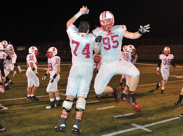 Then juniors and now Arrowhead seniors Nathan Kanneglesser (74) and Billy Hirschfeld (95) celebrate after winning a state title last season.