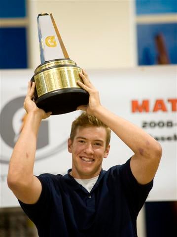 Hobgood holds up National Player of the Year trophy.