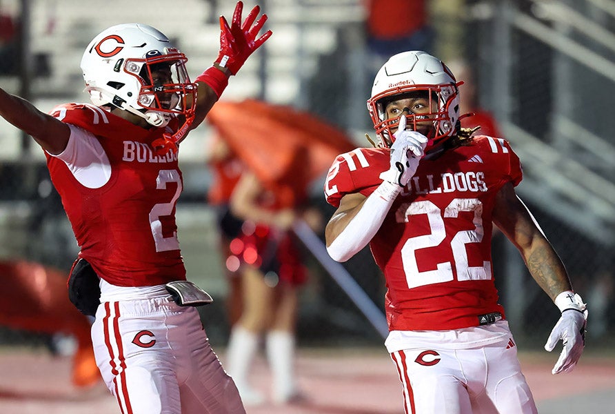 Bryston Price (left) and Javon Landers of Carthage celebrate a touchdown during a 67-36 win over Pine Tree earlier this month. (PHOTO: Brad Kennedy)