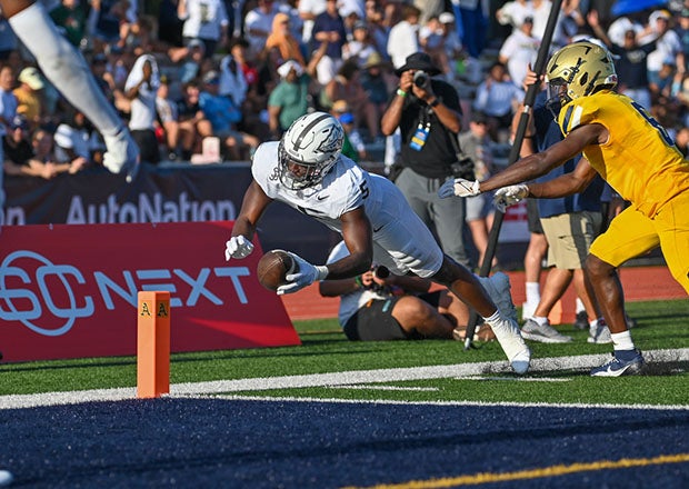 Chauncey Sylvester of St. John Bosco dives for the end zone. (Photo: Patrick Tewey)