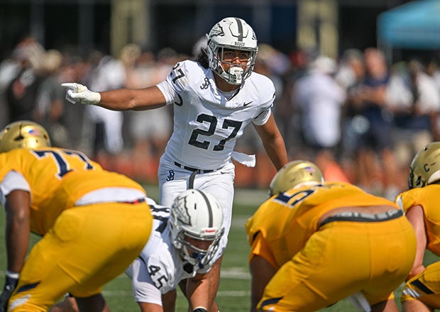 Senior Kyngstonn Viliamu-Asa of St. John Bosco surveys the offense of St. Thomas Aquinas in the Broward County Showcase. St. John Bosco won the game 20-7. (Photo: Patrick Tewey)