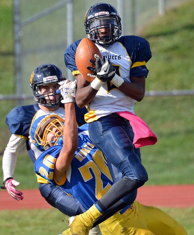 Clayton (N.J.) defensive back Shane Carr attempts to make an interception in front of a Maple Shade receiver.
