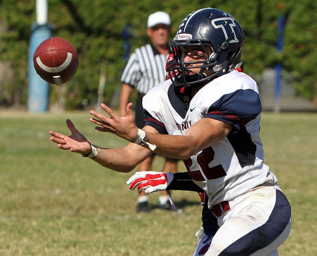 Trinity Classical Academy (Calif.) cornerback Caden Kulp looks to make an interception against Faith Baptist. 