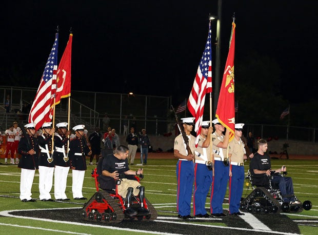 The color guard help lead the the National Anthem. 