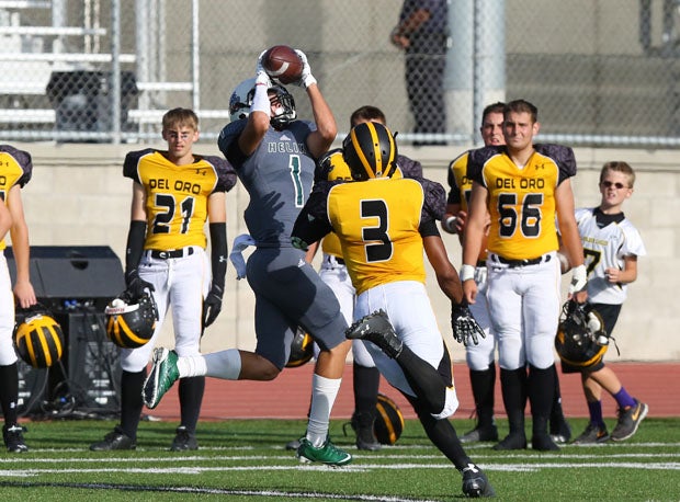 Dashawn Keirsey Jr., of Helix, goes up high for pass.