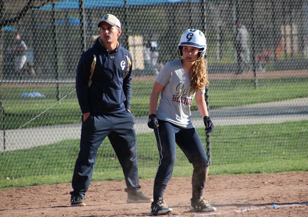 MaxPreps Director of Programing Steve Montoya coaching third base with his softball-playing daughter Whitney. 