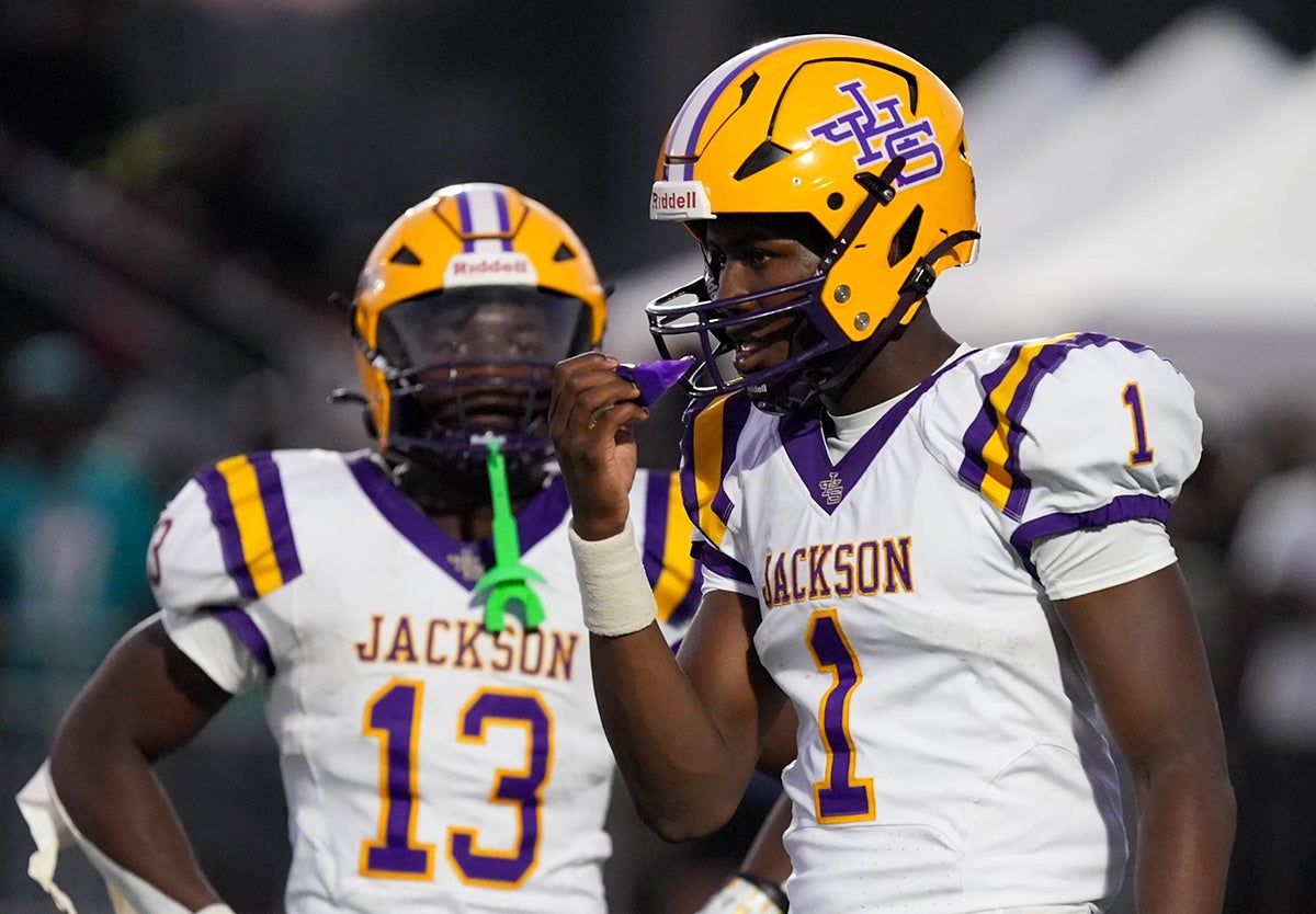 Five-star sophomore running back Ezavier Crowell, left, and four-star junior quarterback Landon Duckworth of Jackson (Ala.) get set before a snap against Saraland in August. (Photo: Brad Boland)