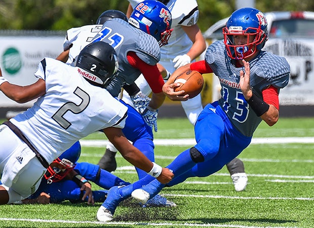 Knox City (Texas) receiver Wesson Ham makes a hard cut while attempting to elude a Water Valley defender.