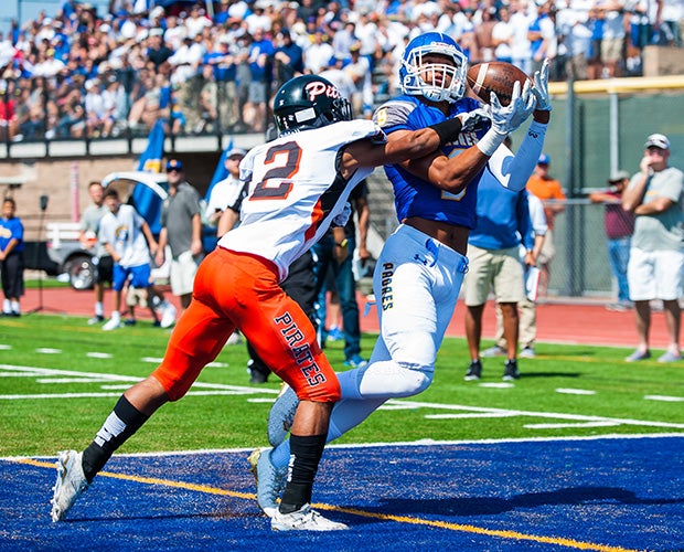 A Serra (San Mateo, Calif.) receiver hauls in a touchdown pass in front of a Pittsburg defender.