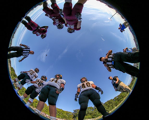 Matawan Regional (N.J.) and Monmouth Regional players watch the coin toss before their game.