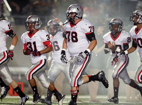 Union taking the field before its game with Trinity. 