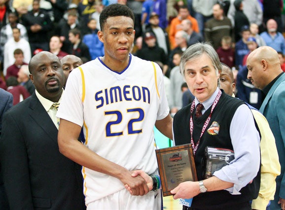 Jabari Parker with Simeon head coach Robert Smith (left) at the Spalding Hoophall Classic in January.
