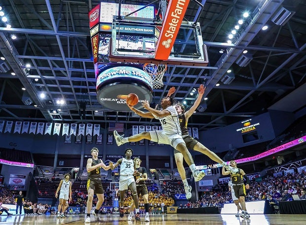 K.V. Stone of Staley goes up for a reverse layup in front of Kickapoo's Brayden Shorter during the MSHSAA Class 6 Championship game in Springfield, Mo. (Photo: David Smith)