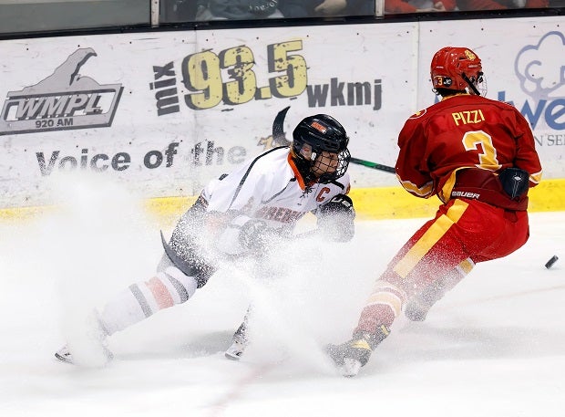 Gaborik Carlson of Houghton and Dominick Pizzi of Hancock slam on the brakes while battling for the puck. (Photo: Chris Hendra)