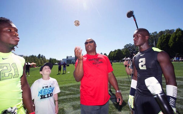 Bo Jackson flips a coin before the championship game.
