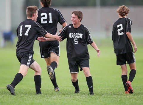 Arapahoe and Sam Myers (5) are the defending state champions in Class 5A. Myers scored two goals in the Warriors' season-opener.