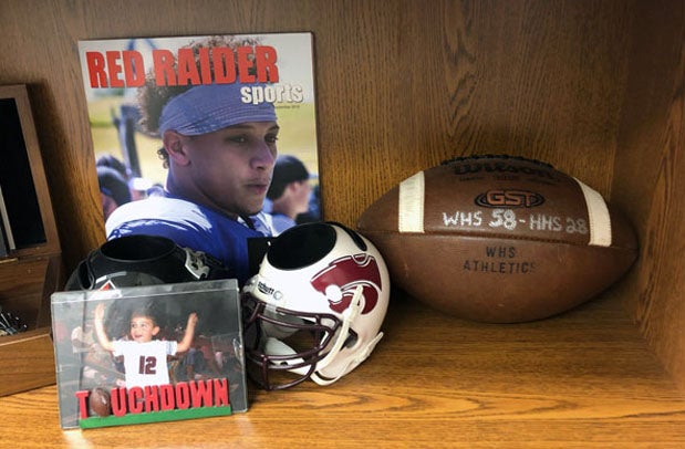 The football that Patrick Mahomes presented to his head coach in 2013 is on display in Adam Cook's office. 