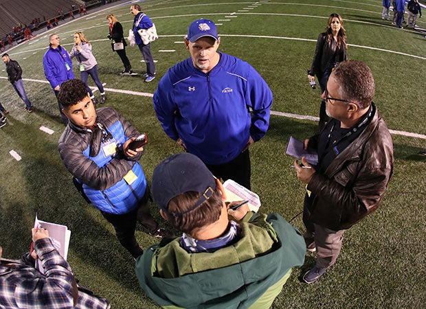 Kris Richardson answering questions from reporters in what turns out to be his last high school football game. 