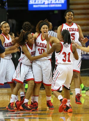 Salesian celebrates its second straight NorCal
title, led by Alana Horton (10) in the middle
hugged by Minyon Moore and approached by
Rayana Ross (31), Mariya Moore (left) and Zoe
Correal (15).