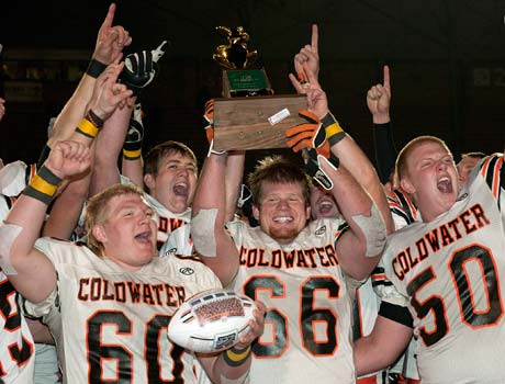 Coldwater players celebrate after winning the Ohio Division 5 title on Saturday.