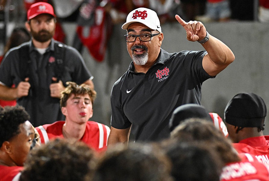 Mater Dei head coach Raul Lara talks to his team after a gritty win over Centennial on Friday night at the Santa Ana Bowl. (PHOTO: Heston Quan)