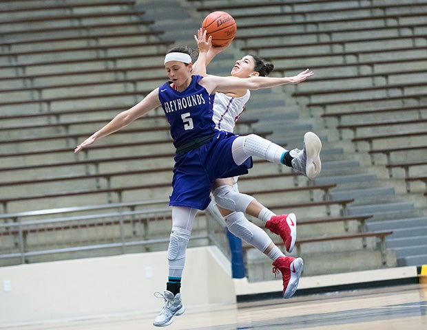 Boerne (Texas) guard Hannah Benac takes a jump shot while defended by Antonian Prep's Gabi Teneyuca.