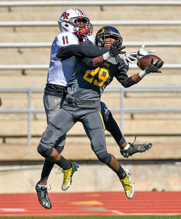 Klein Oak (Texas) cornerback Ja'darious White breaks up a potential touchdown catch by Round Rock receiver Jason Uwaeze in the UIL state playoffs.