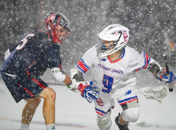 Cherry Creek's Gabriel Minisini (9) goes up against Kent co-captain James Dahlen. 