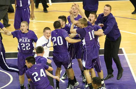 College Park players storm the court after the highest scoring game in Northern California finals playoff history.