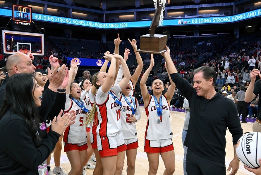 Kelly Sopak holds the trophy high after leading Carondelet to California's Division 1 state title in 2025. (PHOTO: David Steutel)
