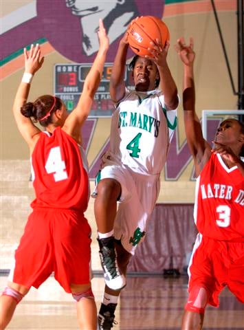 St. Mary's guard Afure Jemerigbe tries to get to hoop.